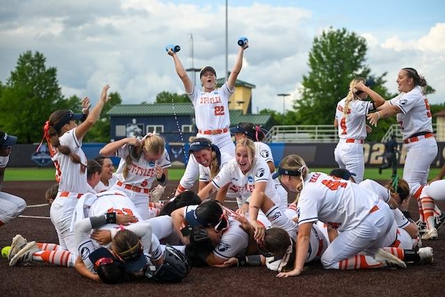 UT Tyler softball players dogpile at the pitcher's circle after repeating as natonal champions. 